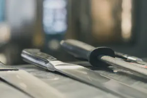 A couple of chef knives laying on the bench